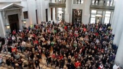 Protesters in the Ohio Statehouse on Wednesday after the state Senate passed a bill to cut the collective bargaining rights of public employees