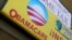 FILE - A sign on an insurance store advertises Obamacare in San Ysidro, San Diego, California, U.S.