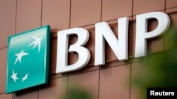 The logo of BNP Paribas is seen on top of the bank's building in Fontenay-sous-Bois, eastern Paris, May 30, 2014. 