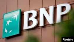The logo of BNP Paribas is seen on top of the bank's building in Fontenay-sous-Bois, eastern Paris, May 30, 2014. 