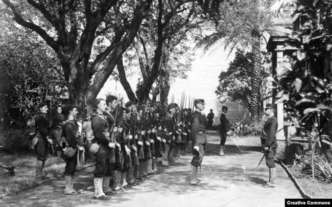 The USS Boston's landing force of U.S. Marines on duty at the Arlington Hotel, Honolulu, at the time of the overthrow of the Hawaiian monarchy, January 1893.