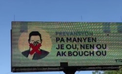 This coronavirus digital billboard Port-au-Prince, Haiti, on April 1, 2020, advises people to avoid touching their eyes, nose and mouth.