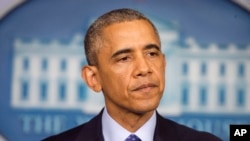 President Barack Obama pauses while speaking about the situation in Iraq, June 19, 2014, in the Brady Press Briefing Room of the White House in Washington.