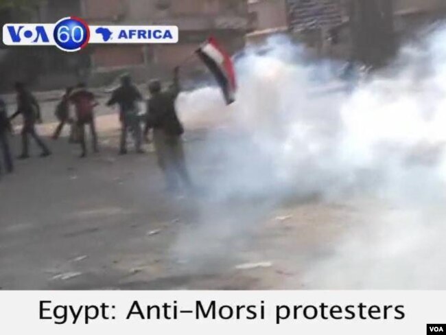 Anti-Morsi protesters in Cairo clash with security forces near Tahrir Square.