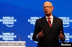 FILE - Klaus Schwab, World Economic Forum (WEF) Executive Chairman and founder speaks during the Crystal Awards ceremony of the annual meeting of the Forum in Davos, Switzerland, Jan. 16, 2017.