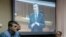 Viktor Yanukovych gives evidence via a video link seen on a courtroom screen in Kyiv, Ukraine, Monday, Nov. 28, 2016. The former president testified during the trial of former police officers suspected of killing protesters during the Maidan street revolt in 2014.
