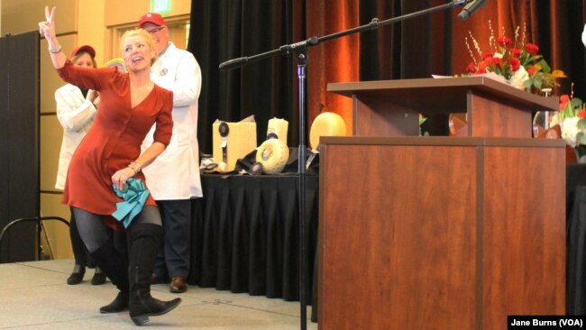 Marieke Penterman of Marieke Gouda does her happy dance that has become a familiar sight at cheese contests. At the U.S. Cheese Championship, her cheeses were ranked No. 2 and No. 3 cheeses among the 2,555, in Green Bay, Wis., March 7 2019.