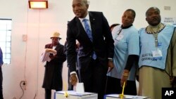 Democratic Alliance leader Mmusi Maimane casts his vote Wednesday, May 8, 2019 in general elections in Soweto, South Africa. 