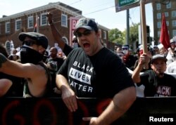 A counterprotester yells at white supremacists during a rally in Charlottesville, Va.., Aug. 12, 2017.