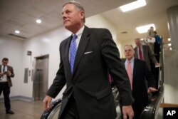 FILE - Senate Intelligence Committee Chairman Richard Burr, R-N.C., and other lawmakers return to their offices on Capitol Hill in Washington, March 2, 2017, after votes to confirm two of President Donald Trump's Cabinet picks.
