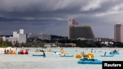 Tourists frolic on the waters overlooking posh hotels in Tumon tourist district on the island of Guam, a U.S. Pacific Territory, Aug. 10, 2017.
