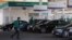 Workers fill cars as people wait in their cars at Emarat petrol stations after an increase in fuel prices in Cairo, Egypt, June 30, 2017. For the third time sine 2015, Egypt has raise fuel prices.