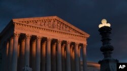 FILE - The Supreme Court is seen at sunset in Washington.