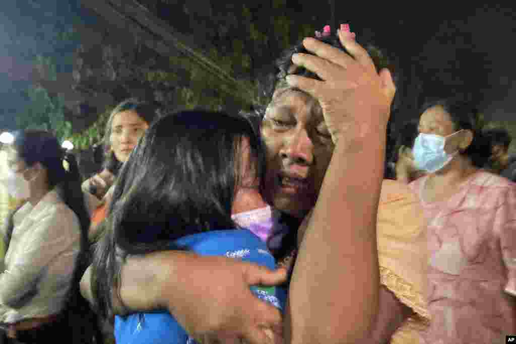 A mother reacts after her daughter, left, was released from Insein Prison in Yangon, Myanmar.&nbsp;Myanmar&#39;s government announced an amnesty for more than 5,600 people arrested for taking part in anti-coup protests. Over 1,000 people were freed from prisons around the country and charges against more than 4,000 others were suspended.&nbsp;