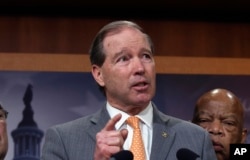 FILE - Sen. Tom Udall, D-N.M., is calling for elections in Zimbabwe "as soon as possible."