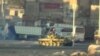 An image grab taken from a video uploaded on YouTube on August 22, 2012 allegedly shows a Syrian army tank deploying the the Nahr Aishe neighborhood of Damascus, August 22, 2012. 