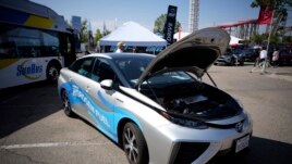 A 2021 Toyota Prius that runs on a hydrogen fuel cell sits on display at the Denver auto show Friday, Sept. 17, 2021, at Elitch's Gardens in downtown Denver. (AP Photo/David Zalubowski)