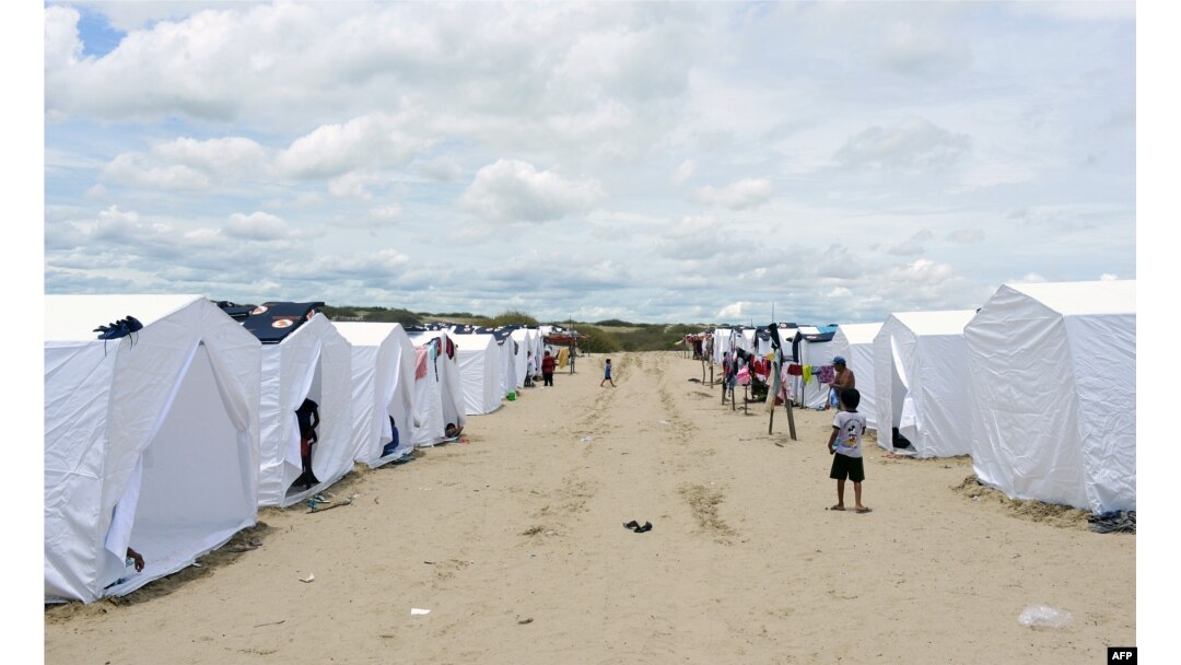Hundreds of people from small villages close to the city of Piura, in northern Peru, are gathering in temporary camps, March 31, 2017, where they receive shelter, food and medical care.