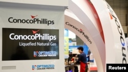 FILE - Logos of ConocoPhillips are seen in its booth at Gastech, the world's biggest expo for the gas industry, in Chiba, Japan, April 4, 2017. 