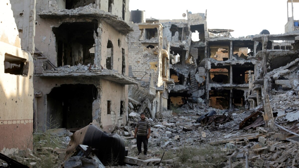 As Guns Fall Silent, Benghazi Residents Return To Battered Homes