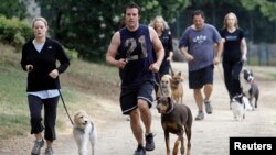 File photograph of owners and their dogs work out during a fitness class in Burbank California