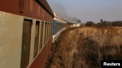 A train carrying passengers and goods travels from Harare to Bulawayo, Zimbabwe, Aug. 6, 2018. 