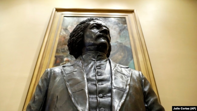 A bronze statue of abolitionist Frederick Douglass is seen during a private viewing ahead of its unveiling at the Maryland State House, Monday, February 10, 2020, in Annapolis.