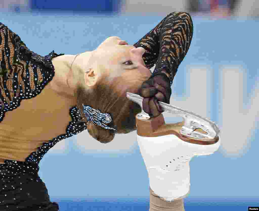 Natalia Popova of Ukraine competes during the figure skating team ladies short program at the Sochi 2014 Winter Olympics in Russia.