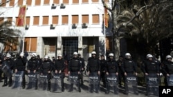 Montenegro riot police guard the Parliament building during an anti-government protest in Podgorica, Montenegro, Feb. 15, 2017. Montenegrin lawmakers voted on Wednesday to lift the immunity of a key opposition leader allegedly involved in a pro-Russian plot to overthrow the government over its NATO bid.