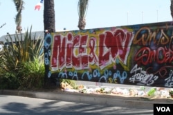 FILE - Graffiti in Nice, France, supports victims of the July 14, 2016, attack as vigils continue day and night after 84 people were killed by a trucker intent on carnage. (H. Murdock/VOA)