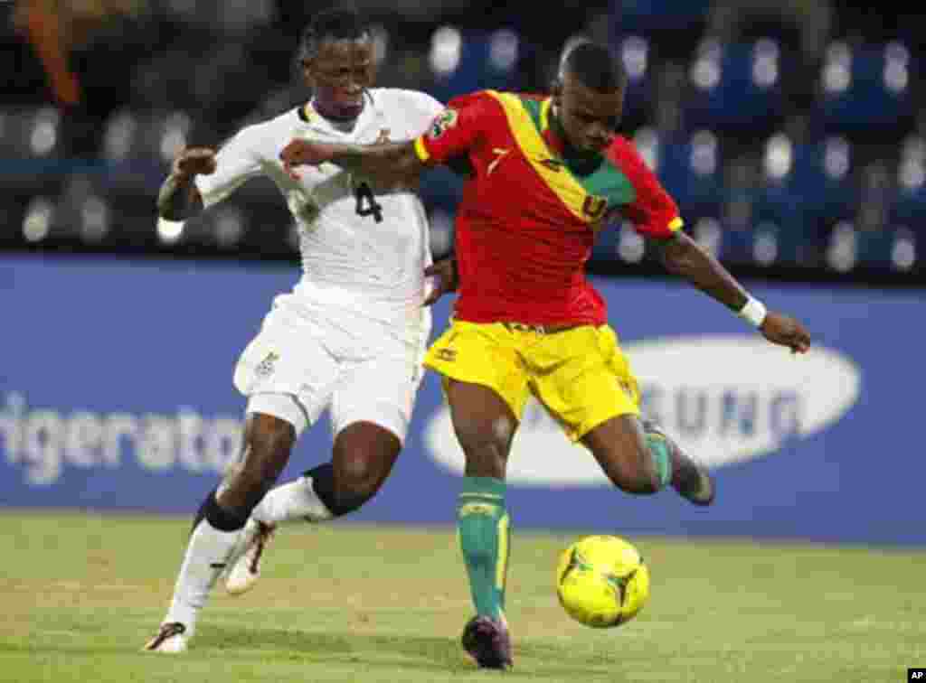 Guinea's Camara Abdoul Razzagui (R) kicks to score against Ghana during their African Cup of Nations Group D soccer match at Franceville stadium February 1, 2012.