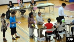 Local residents lined up to vote at a polling station in Matsu island on July 7, 2012, on whether to open the first casino in Taiwan. 