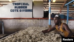 A man works at a rubber factory in Songon village, north of Abidjan, Ivory Coast, Jan. 25, 2016. A delegation of the U.S. Millennium Challenge Corporation, or MCC, is in Ivory Coast to discuss implementation of a major grant designed to fight poverty and boost economic growth in the West African country.