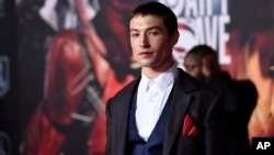 Ezra Miller, a cast member in "Justice League," poses at the premiere of the film at the Dolby Theatre, Nov. 13, 2017, in Los Angeles. 