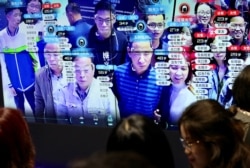 资料照：中国福建省福州市举办的中国数字技术展览会上参观者的脸部在人脸识别技术屏幕上显示。（2019年5月8日）