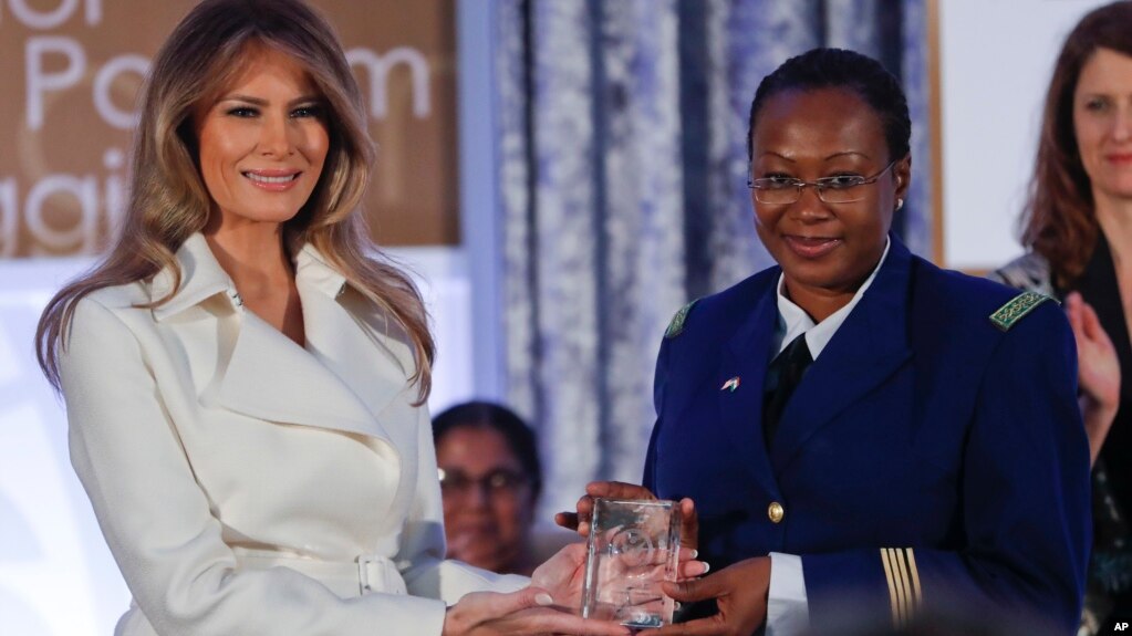 First lady Melania Trump presents the 2017 Secretary's of State's International Women of Courage (IWOC) Award to Major Aichatou Ousmane Issaka, from Niger, March 29, 2017, at the State Department in Washington.
