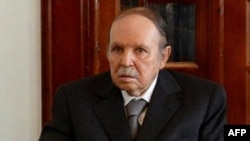 A handout picture released by Algerian Press Service (APS) news agency on July 16, 2013 shows Algeria's President Abdelaziz Bouteflika attending a meeting with political and military figures following his arrival in Algeria at Boufarik military airport, s