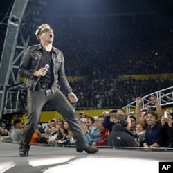Lead singer Bono of Irish rock band U2 performs during their 360 Degree Tour (file photo)
