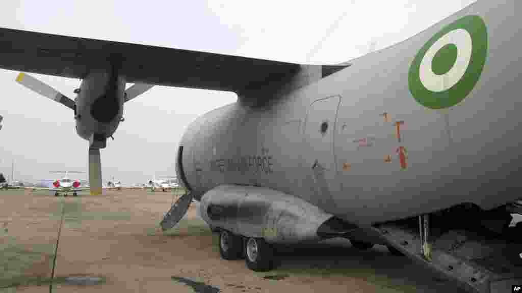 A military plane, used to airlift troops for a military patrol near Maiduguri, is parked at Abuja Airport in Abuja.