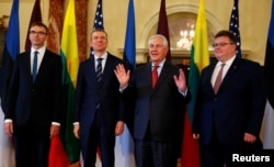 Estonian Foreign Minister Sven Mikser, Latvian Foreign Minister Edgars Rinkevics, U.S. Secretary of State Rex Tillerson and Lithuanian Foreign Minister Linas Linkevicius, are seen before their meeting at the Department of State in Washington, March 28, 2017.