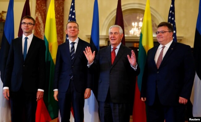 Estonian Foreign Minister Sven Misker, Latvian Foreign Minister Edgars Rinkevics, U.S. Secretary of State Rex Tillerson and Lithuanian Foreign Minister Linas Linkevicius, are seen before their meeting at the Department of State in Washington, March 28, 2017.