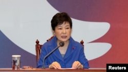FILE - South Korean President Park Geun-hye speaks during an emergency cabinet meeting at the Presidential Blue House in Seoul, South Korea, Dec. 9, 2016. 