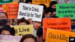 Members of the Regional Tibetan Youth Congress participate in a protest against the alleged human rights violations by the Chinese authorities in Tibet, in Hyderabad, India, January 10, 2013.