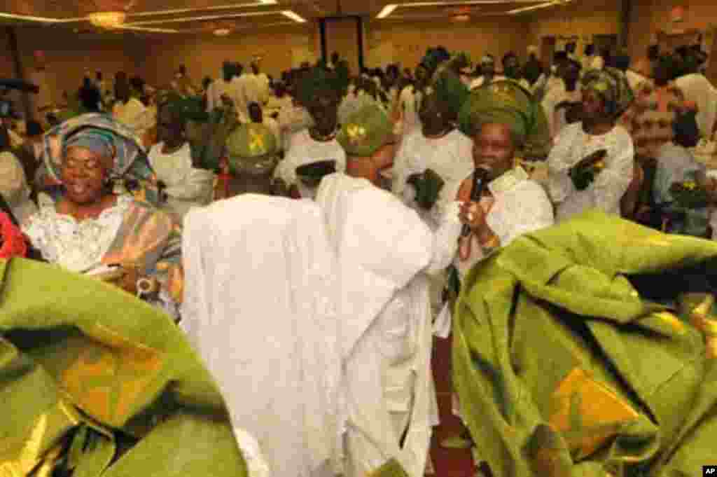 Singing and dancing by the Owo cultural ensemble in honor of the King and Queen of Owo