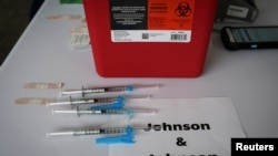 FILE - Doses of Johnson & Johnson coronavirus disease (COVID-19) vaccines are seen in a mass vaccination site supported by the federal government at the Miami Dade College North Campus in Miami, Florida, March 10, 2021. 