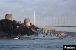 FILE - The Russian Navy's frigate Admiral Makarov sets sail in the Bosphorus, on its way to the Mediterranean Sea, in Istanbul, Turkey, Feb. 28, 2020.