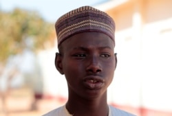 Muhammed Abubakar, a 15-year-old boy who escaped from gunmen who kidnapped hundreds of students from his school, looks on in Kankara, in northwestern Katsina state, Nigeria, Dec. 14, 2020.