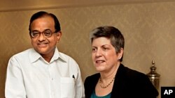 Indian Home Minister P Chidambaram, left, shakes hands with US Secretary of Homeland Security Janet Napolitano, prior to a delegation level meeting in New Delhi, India, May 27, 2011.