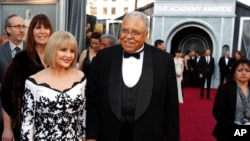 FILE - James Earl Jones, right, and Cecilia Hart arrive before the 84th Academy Awards on Feb. 26, 2012, in the Hollywood section of Los Angeles.