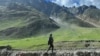 FILE - An Indian army soldier stands guard at Zoji La pass in Kargil, connecting Srinagar and the federal territory of Ladakh bordering China, Aug. 29, 2023.